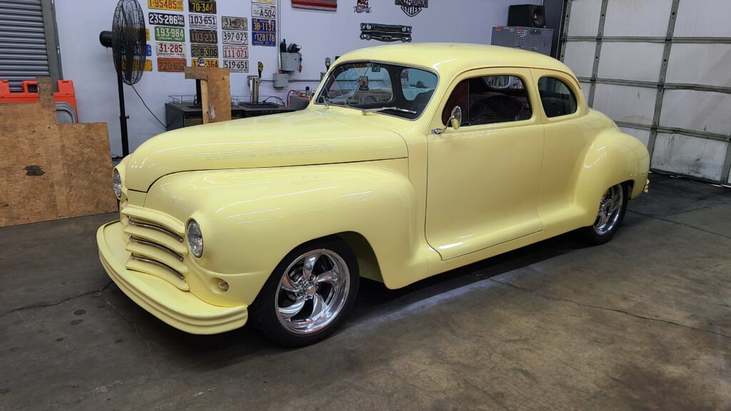 1948 Plymouth coupe in butter yellow