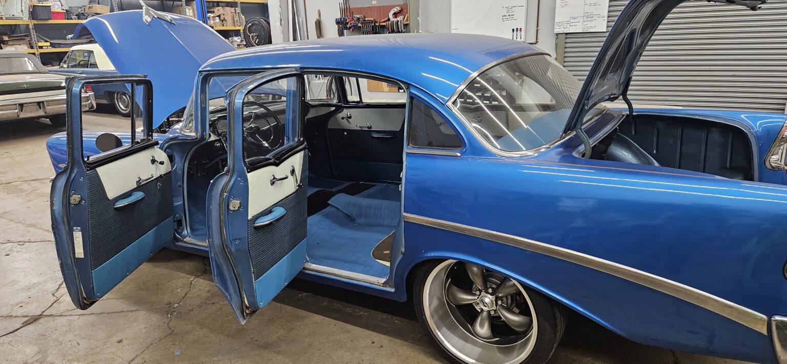 1956 Chevy 210 four door with the doors open