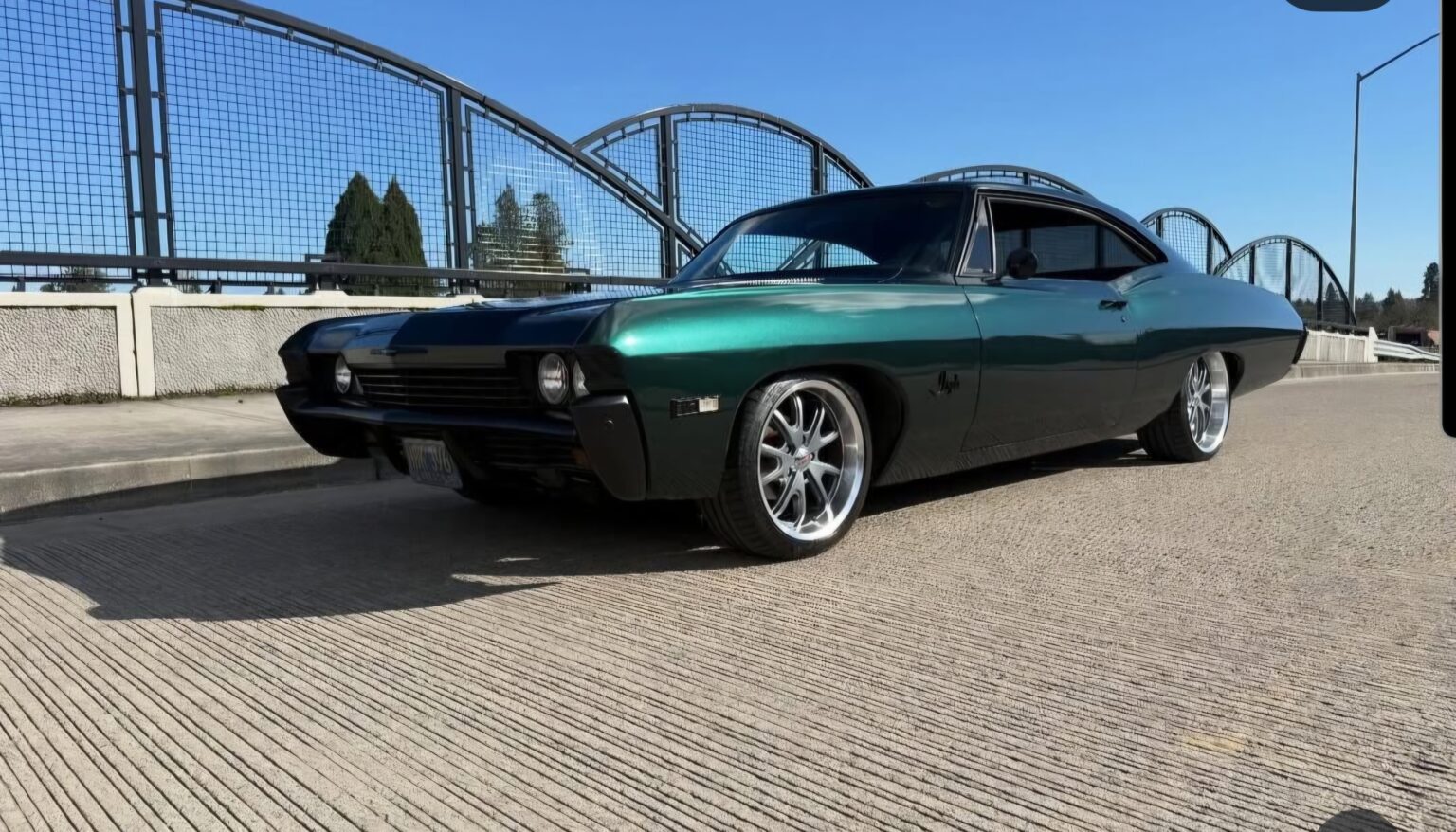 1968 Chevy Impala, lowered, in dark green